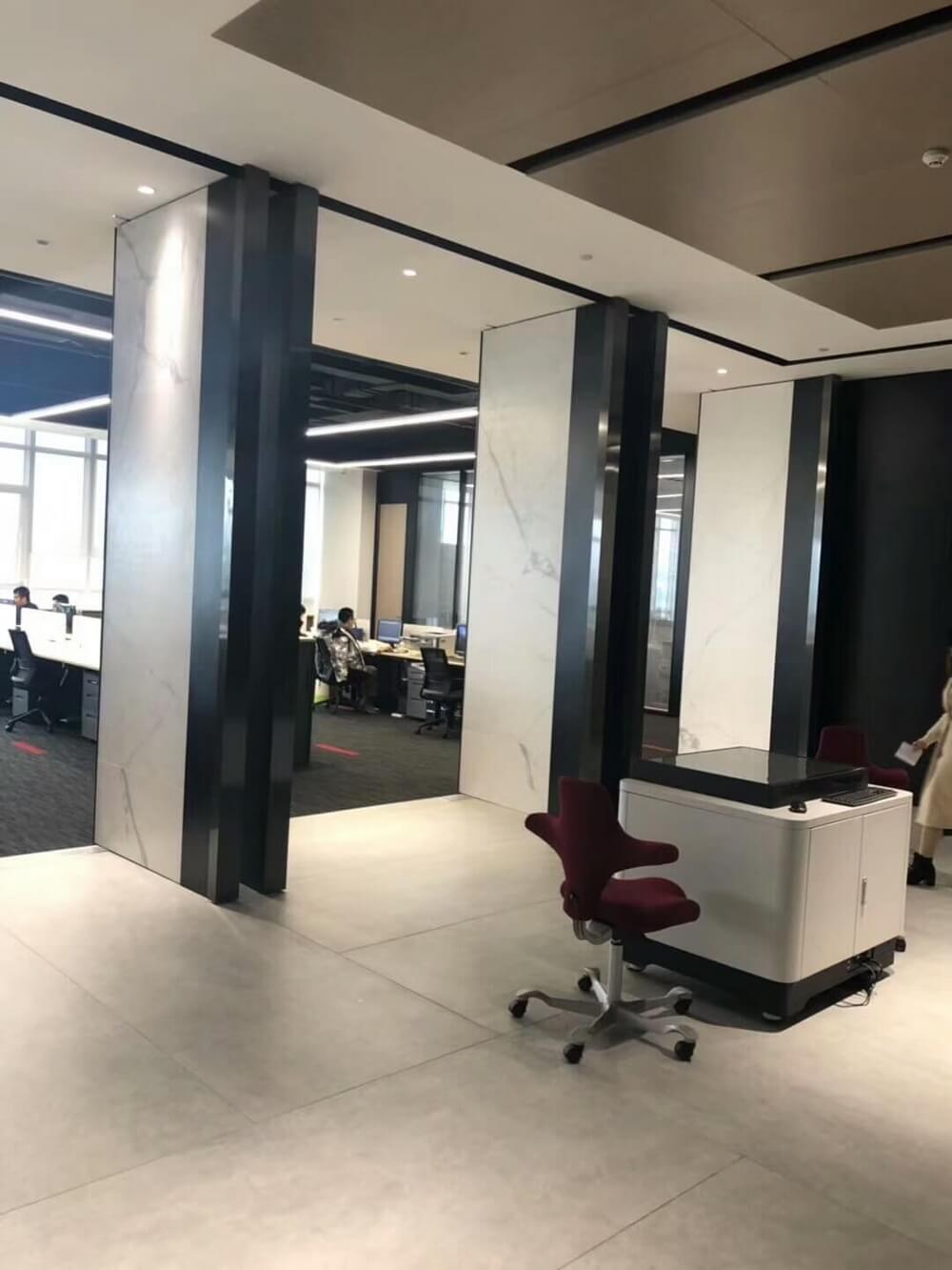 white thin porcelain panels for office walls and floors.jpg